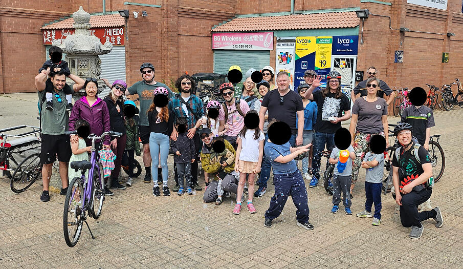 May 2026 A group of three dozen children and adults in Chicago's Chinatown with bikes and helmets.